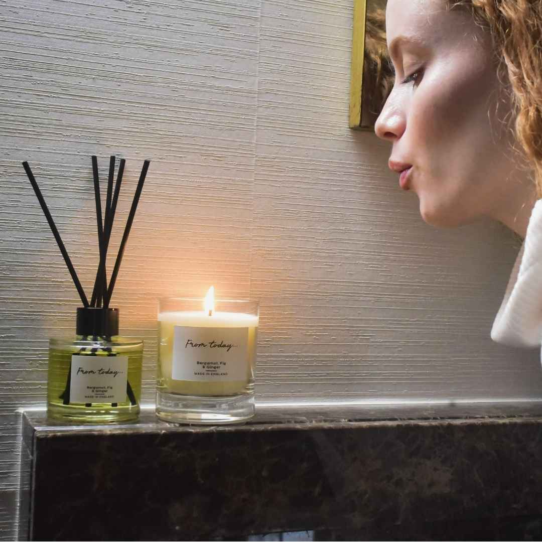 Bergamot, Fig & Ginger luxury scented 200g candle and reed diffuser displayed on a fireplace