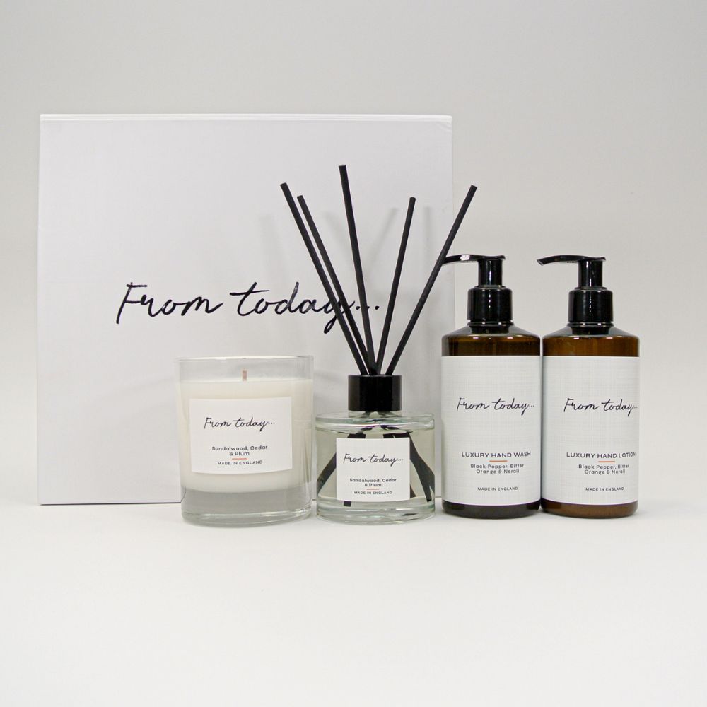 Uplifting luxury gift set with beautiful gift box. Sandalwood, Cedar & Plum candle and reed diffuser and Black Pepper, Bitter Orange & Neroli Hand Wash & Hand Lotion