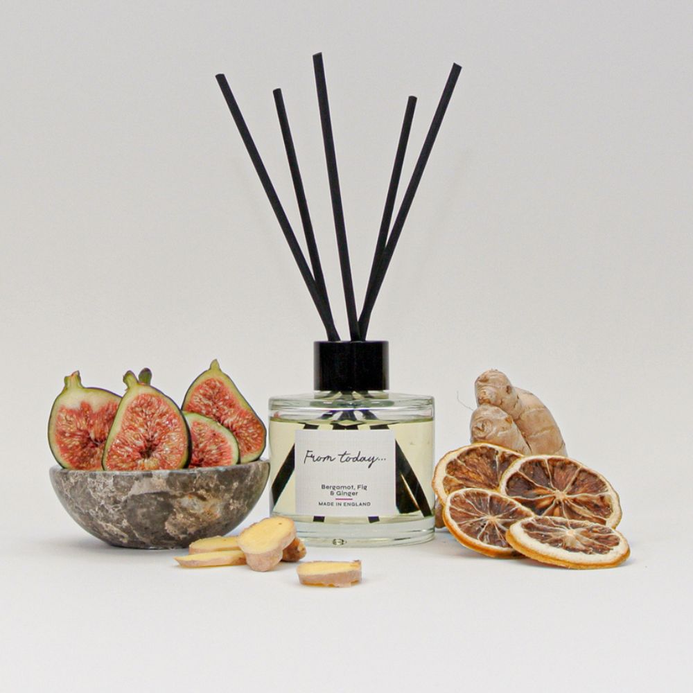 Luxury Bergamot, Fig and Ginger Reed Diffuser surrounded by fruit